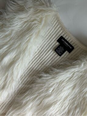 White faux fur vest